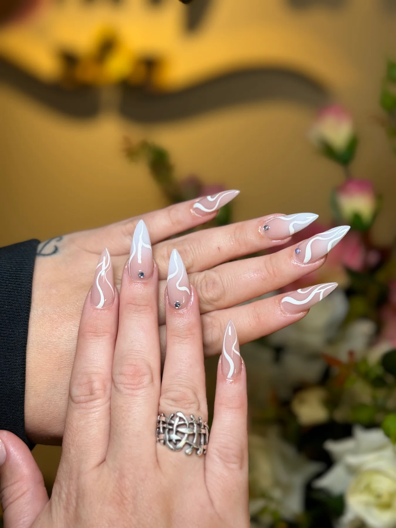 Soft pink and white swirl nail art