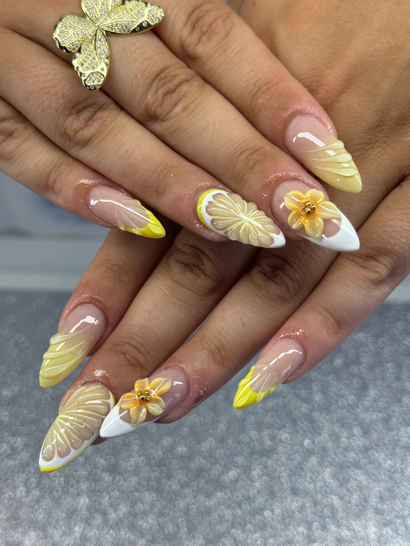 Yellow floral French tip nail design